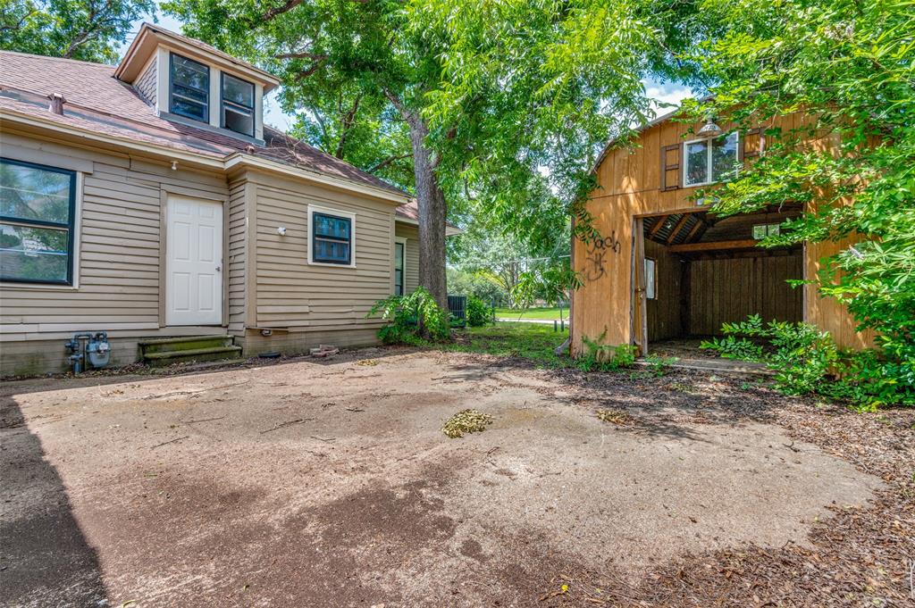 408 West Decatur Street Ennis, TX 75119 - Photo 15 of 15 a view of a house with a yard