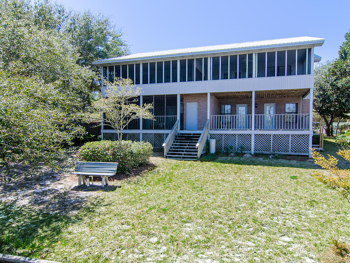 111 B Blue Lake Road Santa Rosa Beach, FL 32459 - Photo 1 of 34 a front view of a house with garden