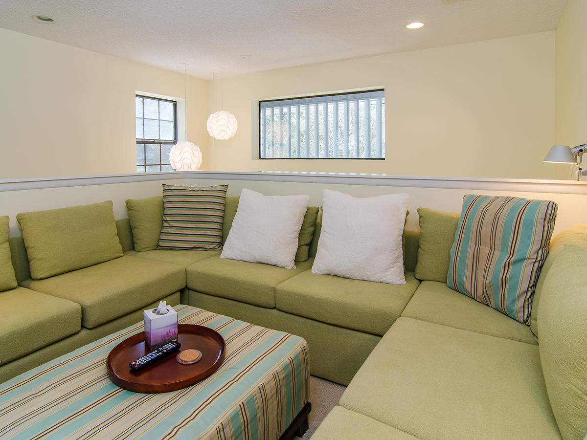 111 B Blue Lake Road Santa Rosa Beach, FL 32459 - Photo 25 of 34 a living room with furniture and a wooden floor
