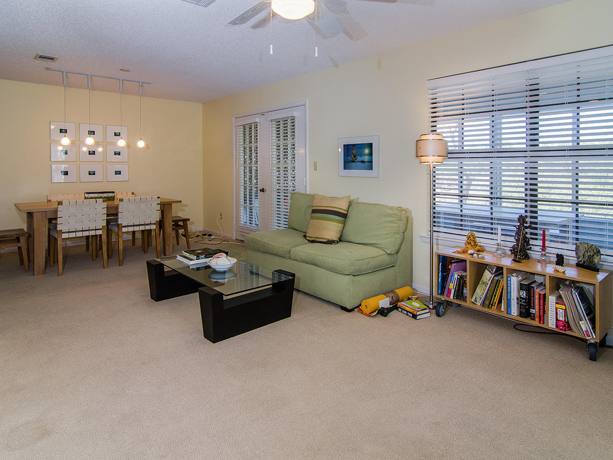 111 B Blue Lake Road Santa Rosa Beach, FL 32459 - Photo 26 of 34 a living room with furniture and a large window