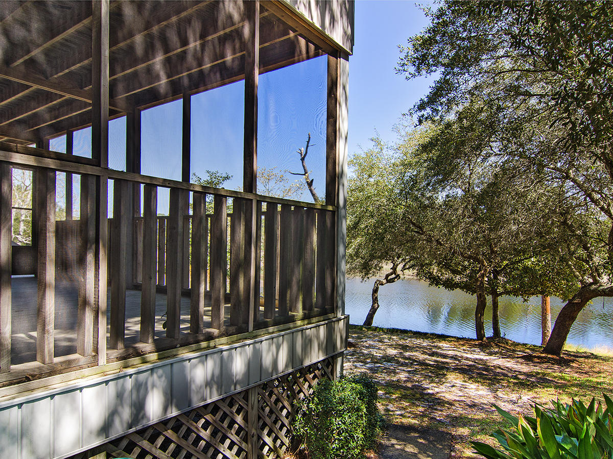 111 B Blue Lake Road Santa Rosa Beach, FL 32459 - Photo 7 of 34 a view of balcony with wooden floor and fence