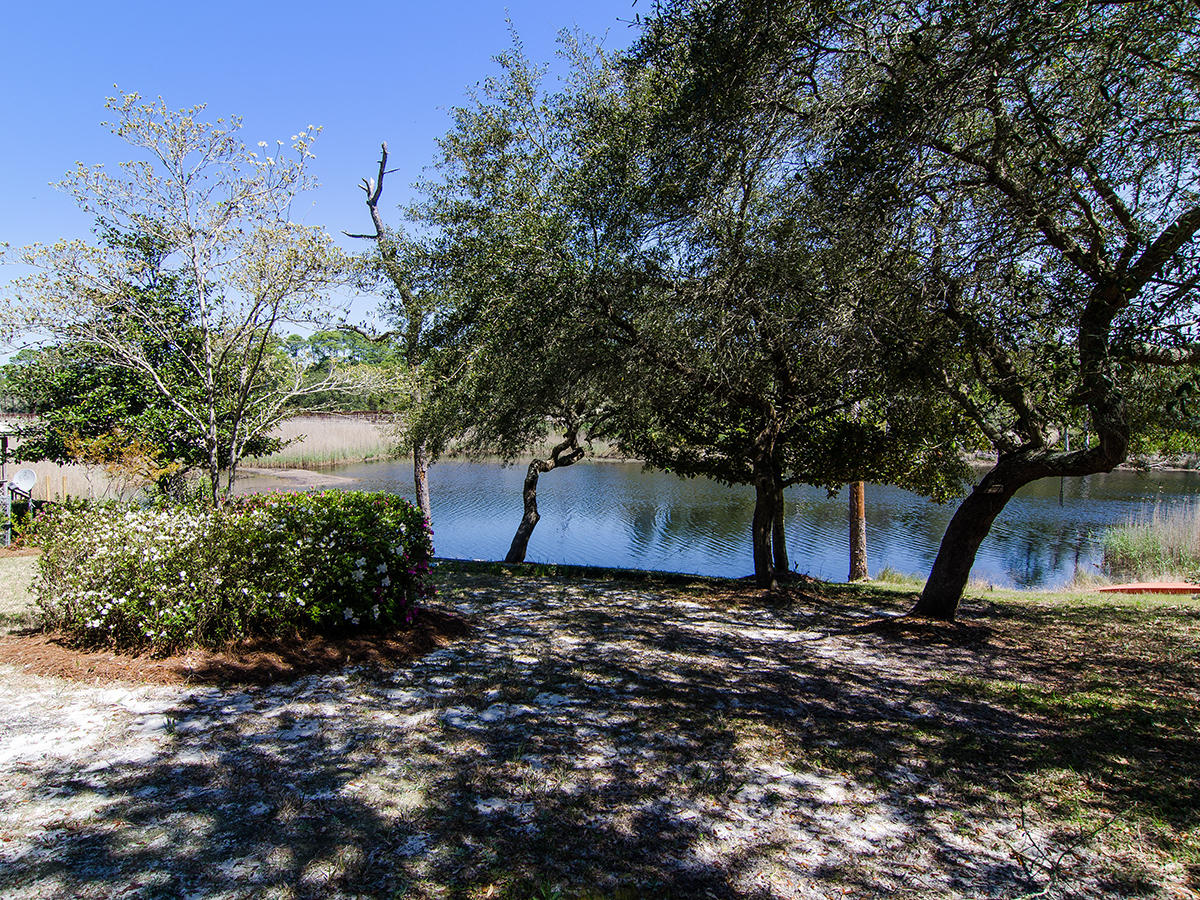 111 B Blue Lake Road Santa Rosa Beach, FL 32459 - Photo 8 of 34 a view of a backyard