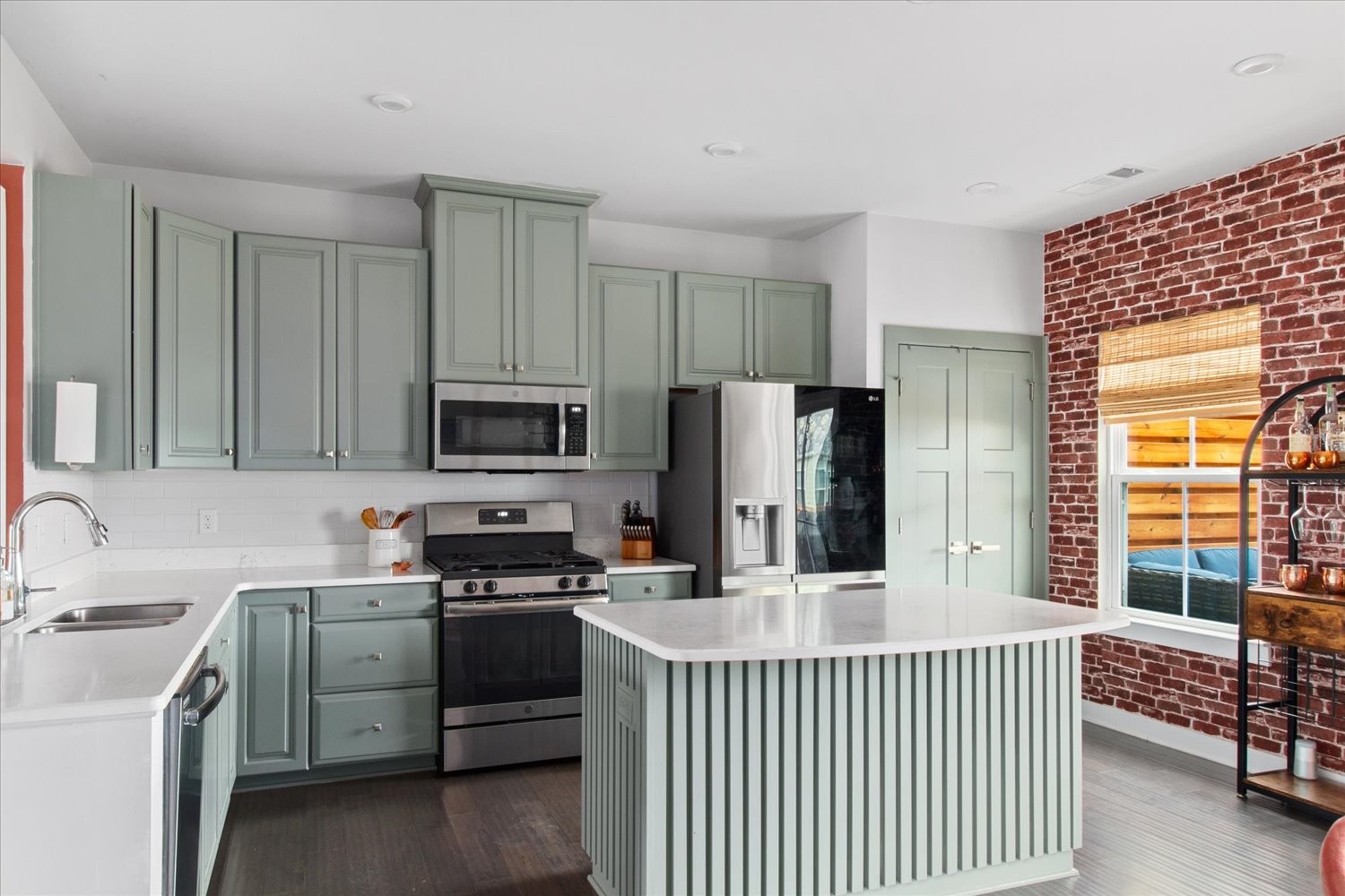 9357 Barco Road Brentwood, TN 37027 - Photo 12 of 29 a kitchen with a stove a sink and a microwave