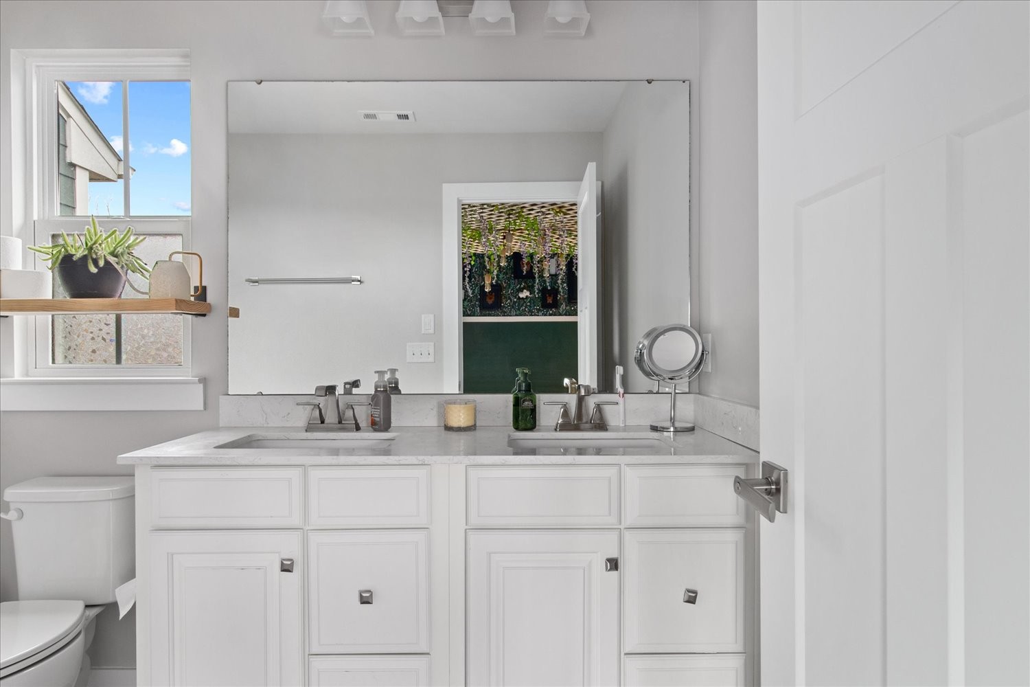 9357 Barco Road Brentwood, TN 37027 - Photo 18 of 29 a bathroom with a double vanity sink and a mirror