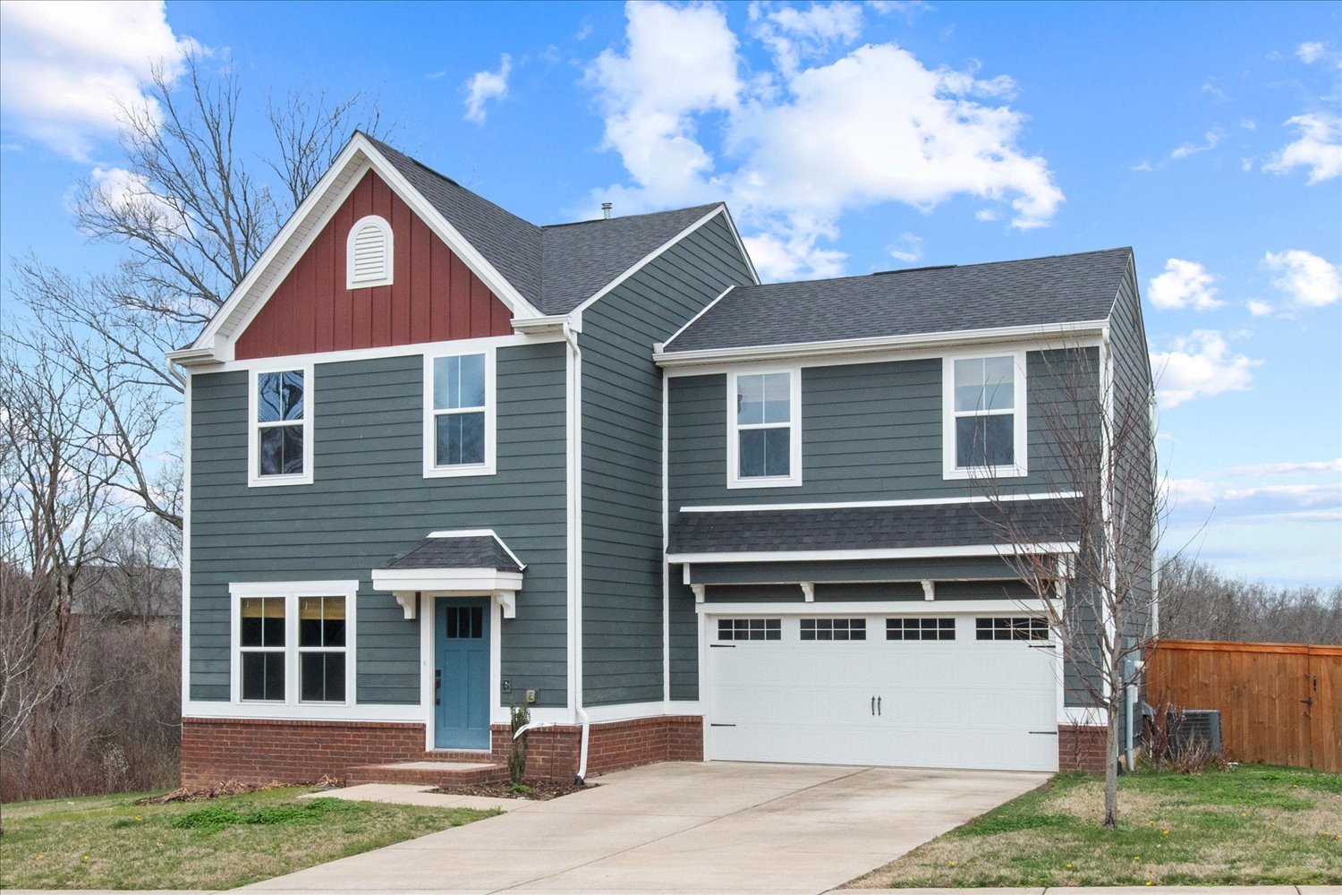 9357 Barco Road Brentwood, TN 37027 - Photo 4 of 29 a front view of a house with a yard and garage