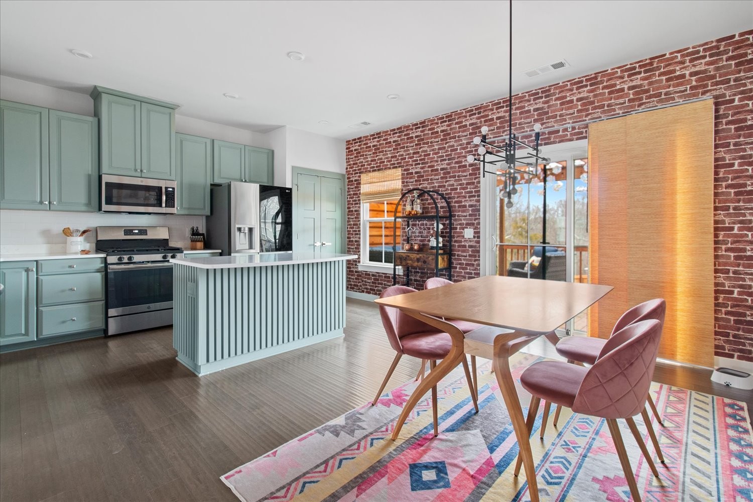 9357 Barco Road Brentwood, TN 37027 - Photo 8 of 29 a dining room with a table chairs and a kitchen view