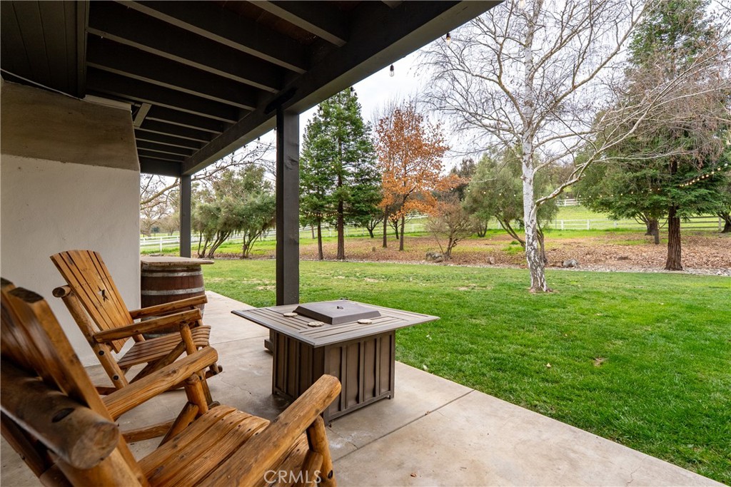 805 Spring Creek Way Templeton, CA 93465 - Photo 45 of 65 a view of a patio with a table chairs and a backyard
