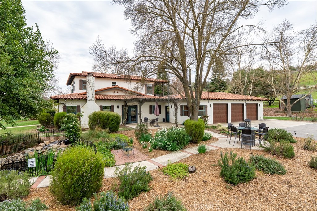 805 Spring Creek Way Templeton, CA 93465 - Photo 5 of 65 a front view of a house with garden and trees