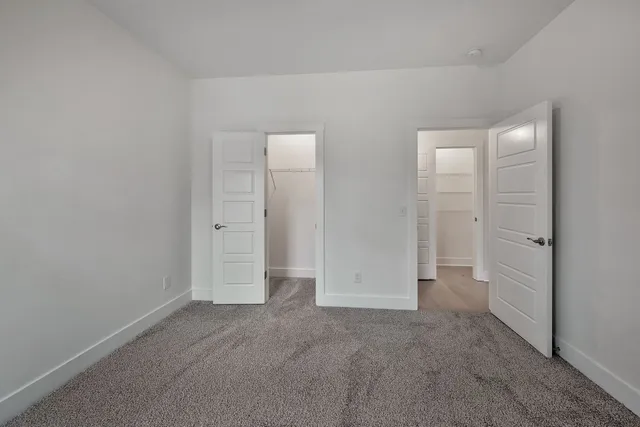 an empty room with closet area