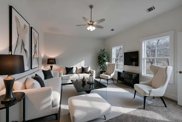 a living room with furniture and a flat screen tv