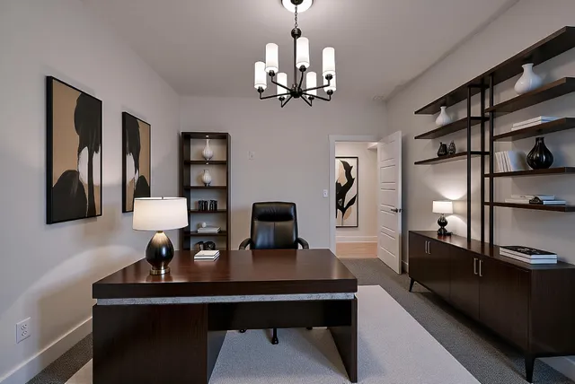 a view of a workspace with furniture