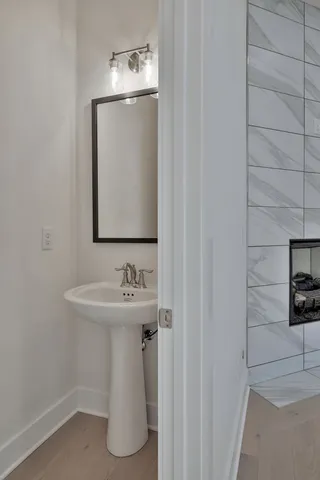a bathroom with a sink and mirror