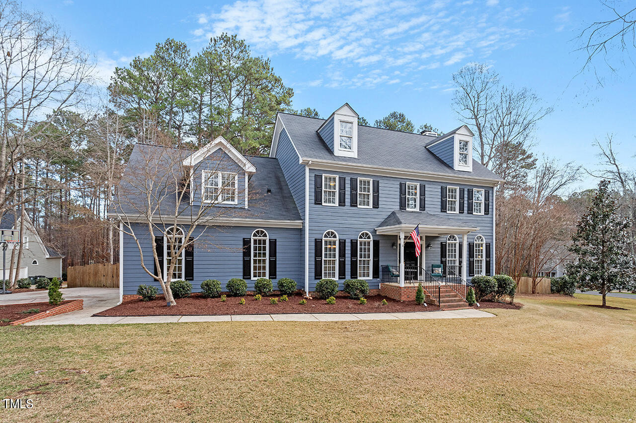 2709 Dray Court Raleigh, NC 27613 - Photo 48 of 51 a front view of a building with a garden