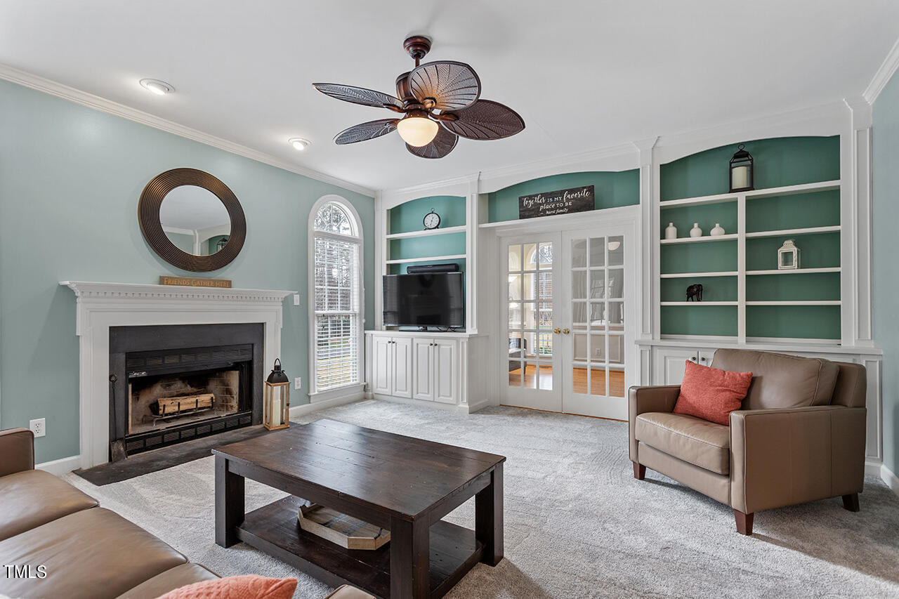 2709 Dray Court Raleigh, NC 27613 - Photo 7 of 51 a living room with furniture and a fireplace