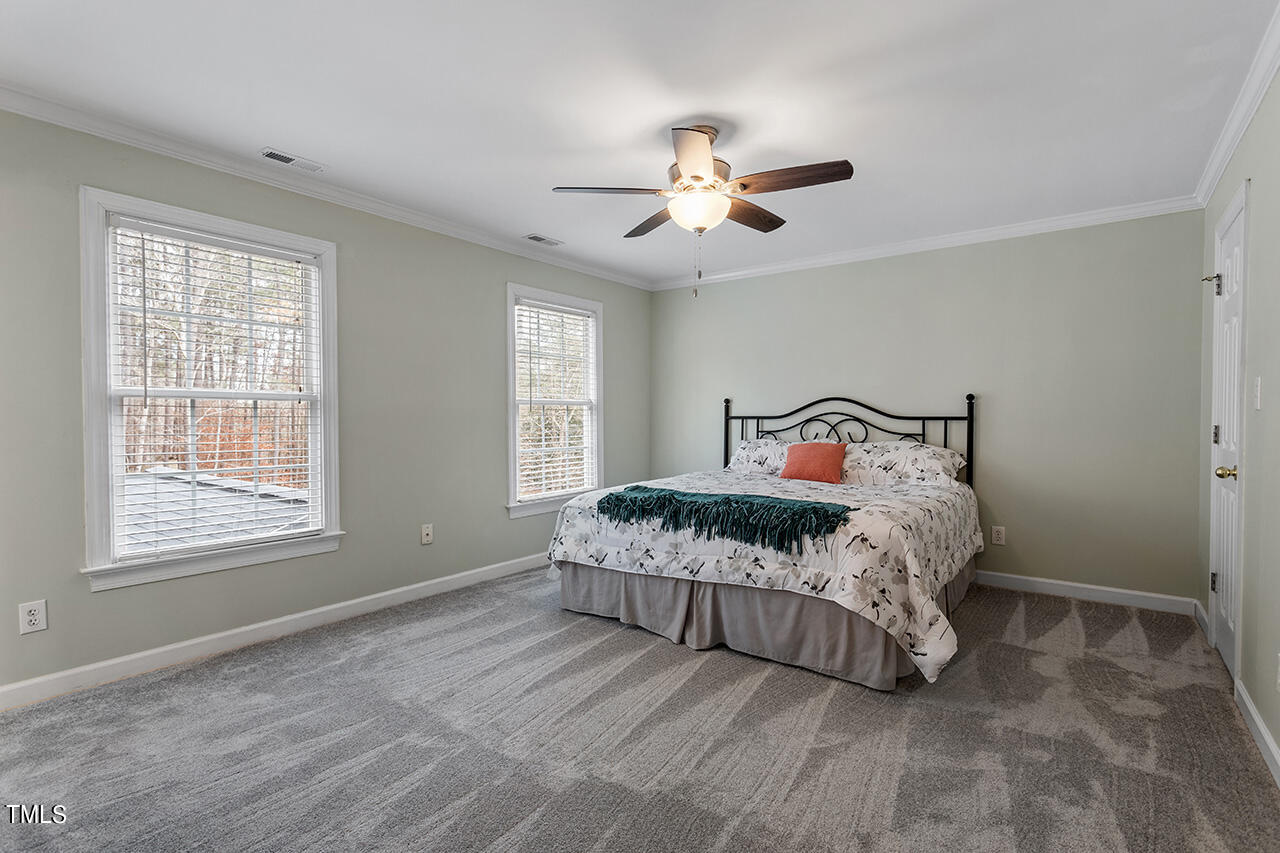 2709 Dray Court Raleigh, NC 27613 - Photo 8 of 51 a bedroom with a bed and window