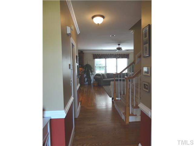 9321 Stone Mountain Road Raleigh, NC 27613 - Photo 12 of 25 a view of entryway and hall with wooden floor