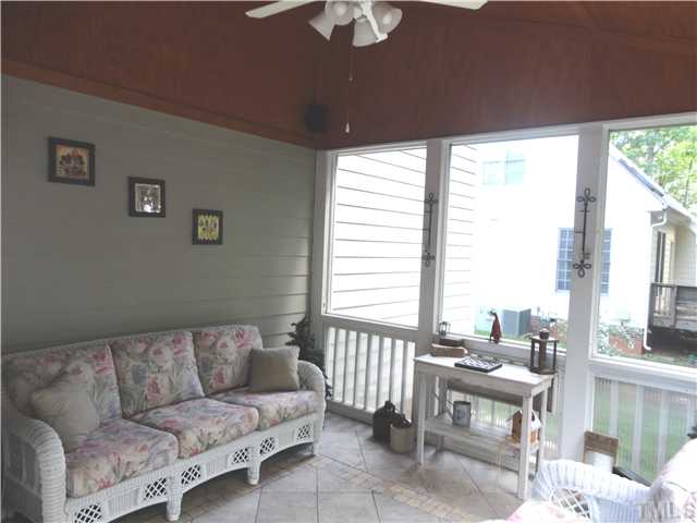9321 Stone Mountain Road Raleigh, NC 27613 - Photo 15 of 25 a living room with furniture and a large window