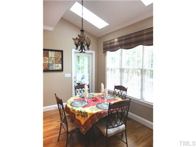 9321 Stone Mountain Road Raleigh, NC 27613 - Photo 7 of 25 a dining room with furniture and window