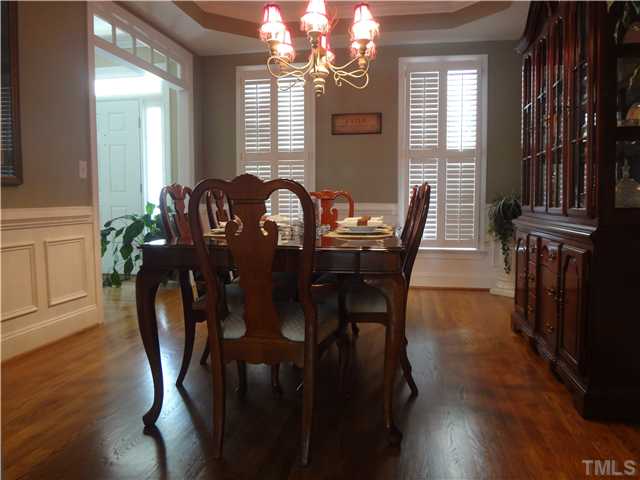 9321 Stone Mountain Road Raleigh, NC 27613 - Photo 10 of 25 a view of a dining room with furniture and window
