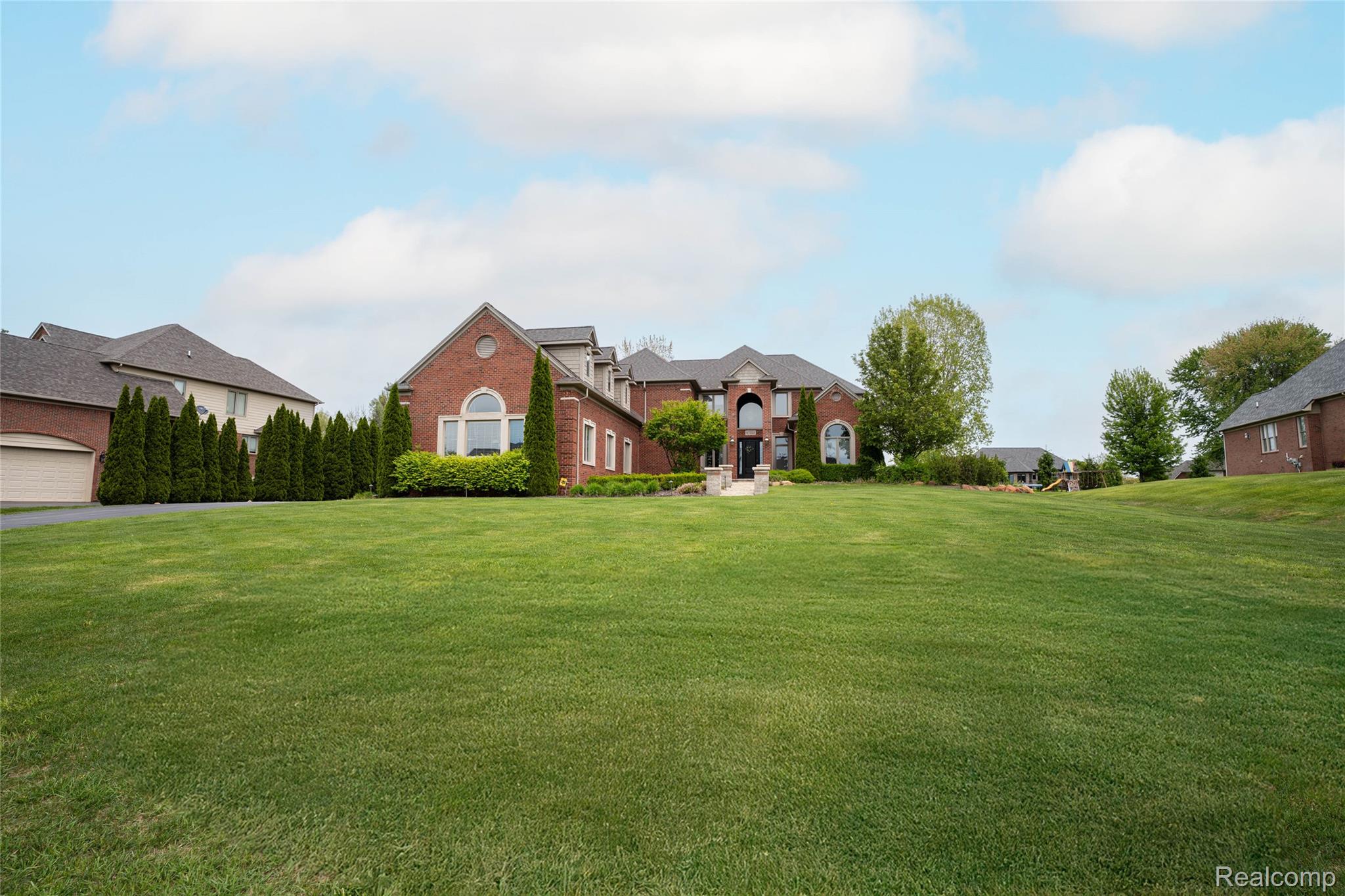 67102 Rachael Lane Washington, MI 48095 - Photo 2 of 37 View of green lawn
