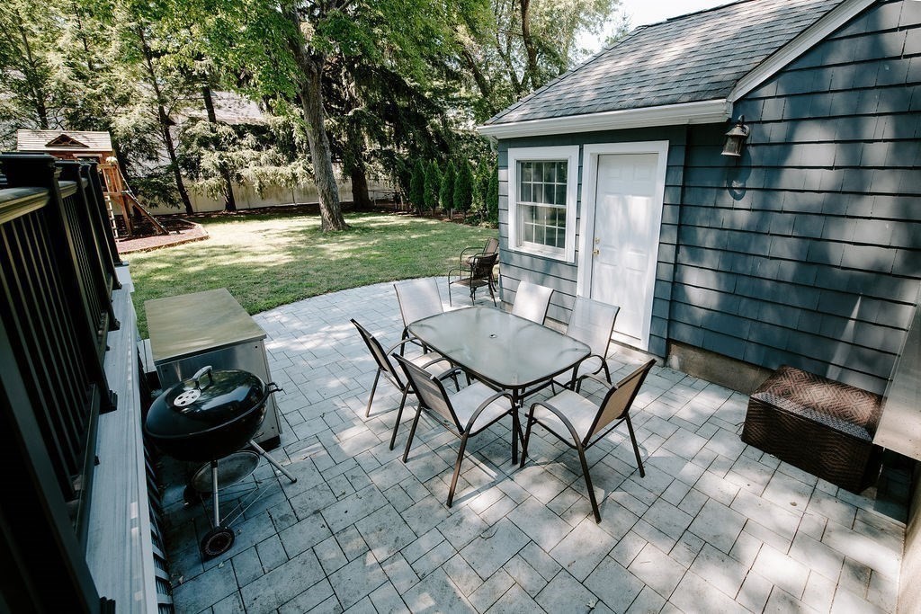 17 Eliot Road Belmont, MA 02478 - Photo 32 of 37 a view of a patio with table and chairs and potted plants