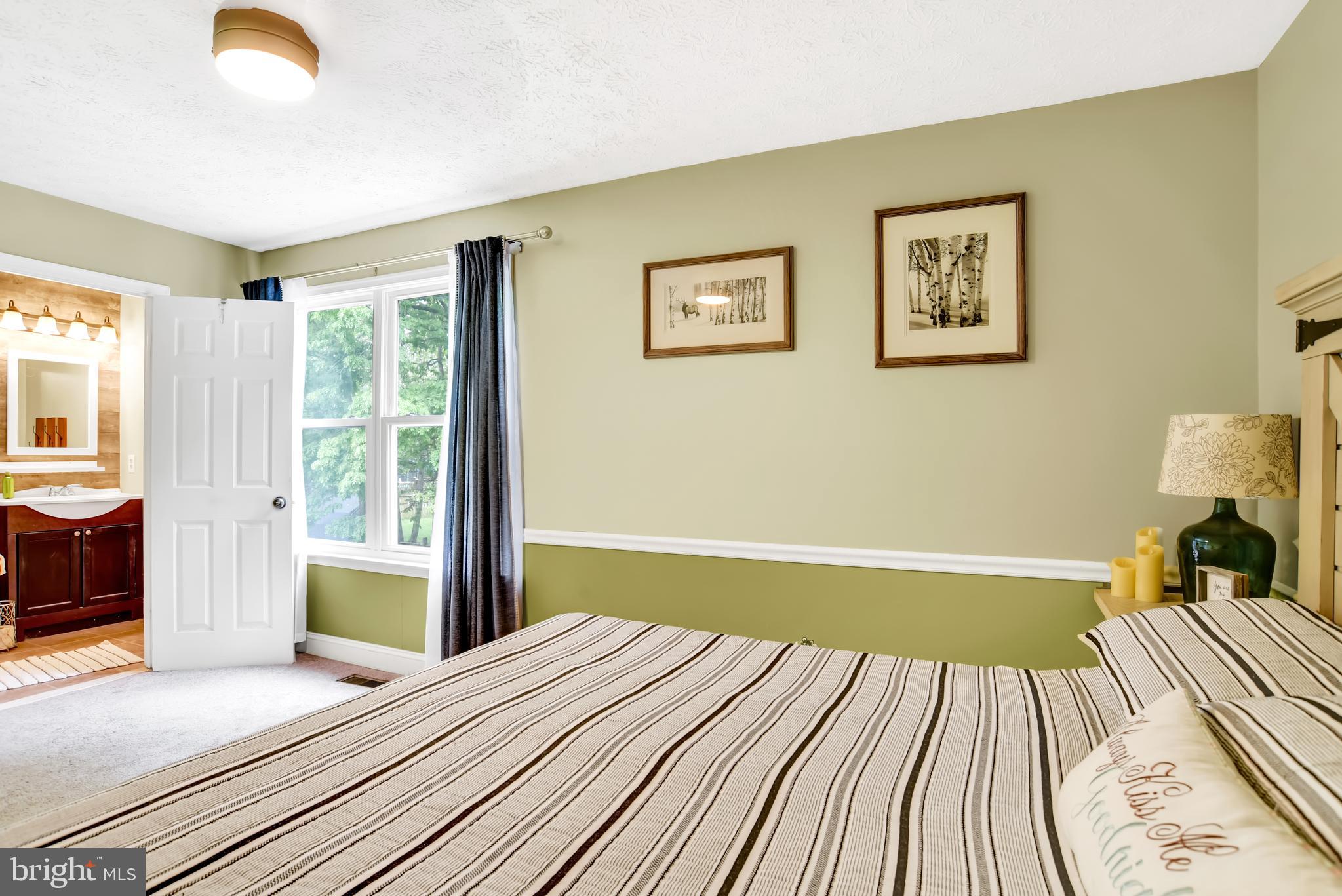 3442 Brookhaven Road Pasadena, MD 21122 - Photo 14 of 30 Master features ceiling fan and chair rail!