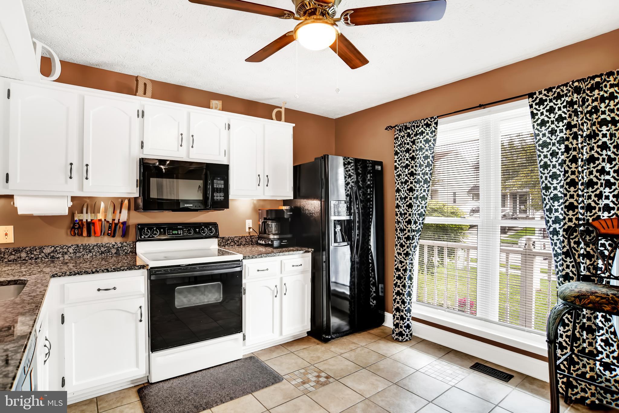 3442 Brookhaven Road Pasadena, MD 21122 - Photo 5 of 30 Kitchen features tile floor and ceiling fan.