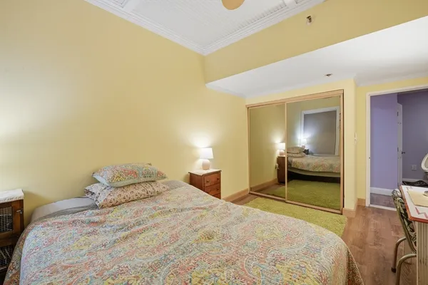 a bedroom with a bed and a lamp