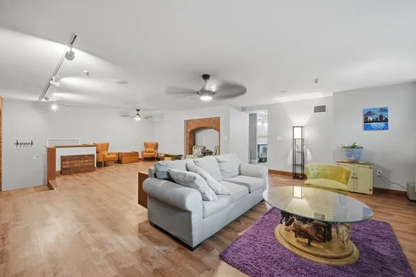 a living room with furniture and a rug