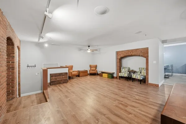 a view of a livingroom with furniture and a flat screen tv