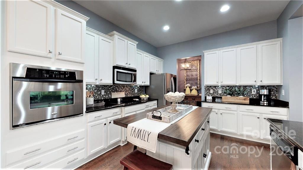 2007 Fallondale Road Waxhaw, NC 28173 - Photo 11 of 48 a kitchen with a sink a counter and cabinets
