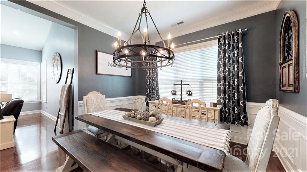 2007 Fallondale Road Waxhaw, NC 28173 - Photo 16 of 48 a view of a dining room with furniture window and wooden floor