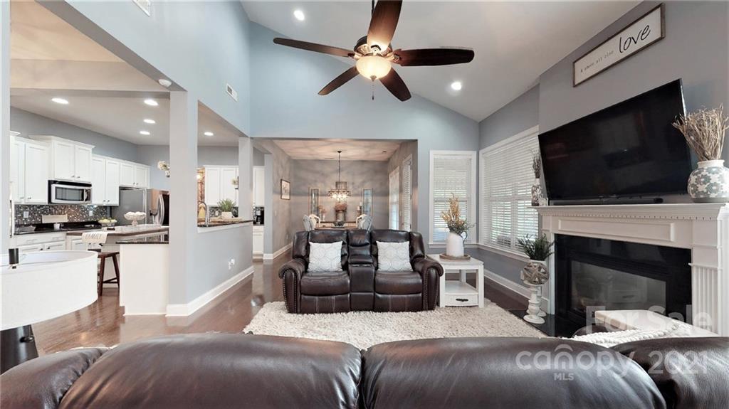 2007 Fallondale Road Waxhaw, NC 28173 - Photo 19 of 48 a living room with furniture a fireplace and a flat screen tv