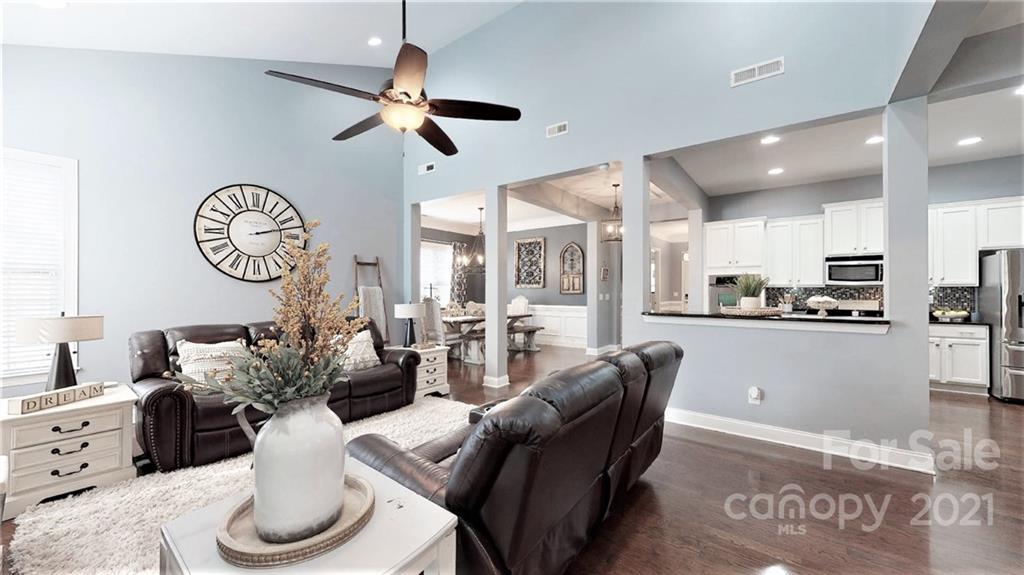 2007 Fallondale Road Waxhaw, NC 28173 - Photo 21 of 48 a living room with furniture a chandelier and a large window
