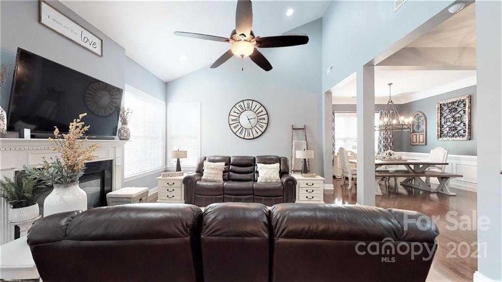 2007 Fallondale Road Waxhaw, NC 28173 - Photo 22 of 48 a living room with furniture a flat screen tv and a fireplace