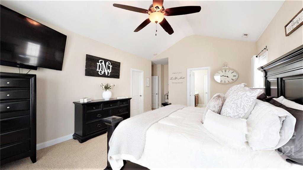 2007 Fallondale Road Waxhaw, NC 28173 - Photo 30 of 48 a bedroom with a bed and a flat screen tv