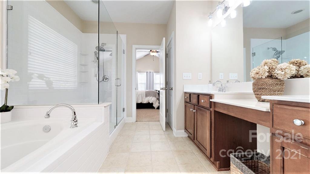 2007 Fallondale Road Waxhaw, NC 28173 - Photo 33 of 48 a spacious bathroom with a tub sink and mirror