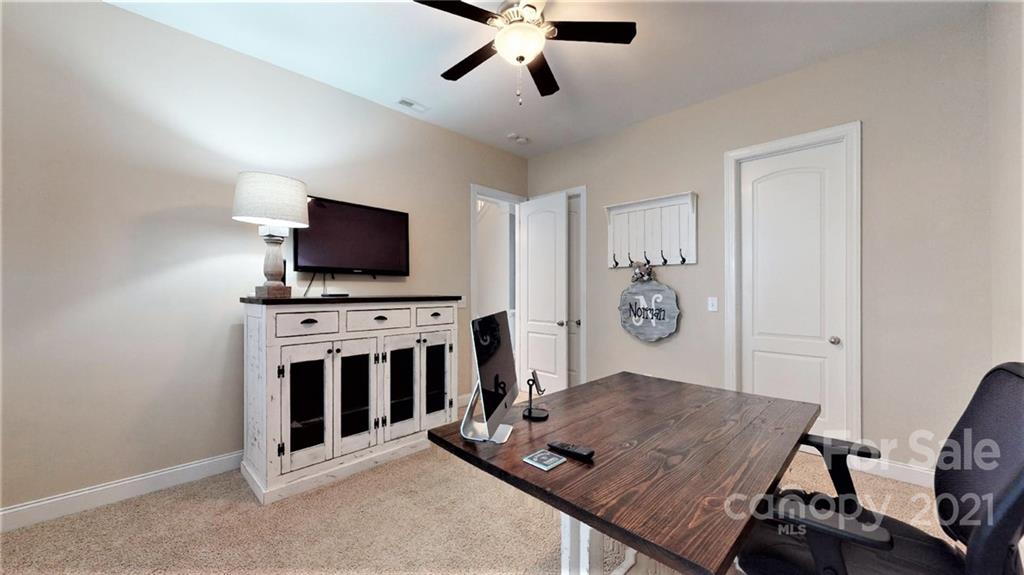 2007 Fallondale Road Waxhaw, NC 28173 - Photo 5 of 48 a living room with furniture and a flat screen tv