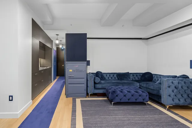 a view of living room with furniture and rug