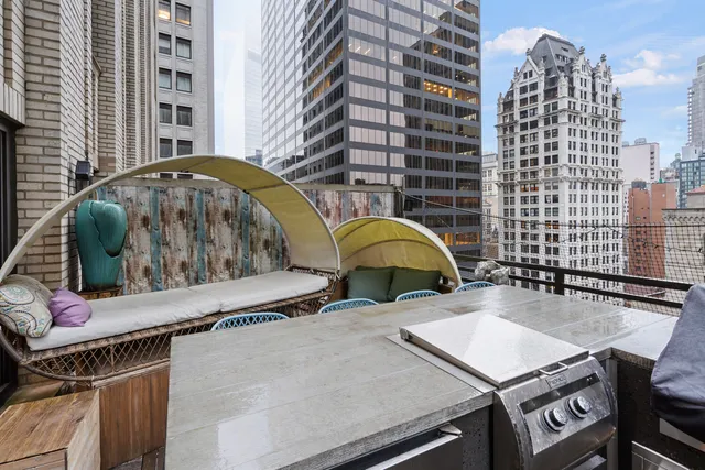 a living room with furniture and a rug