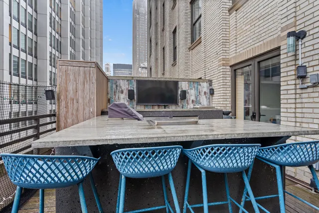 a backyard of a house with barbeque oven