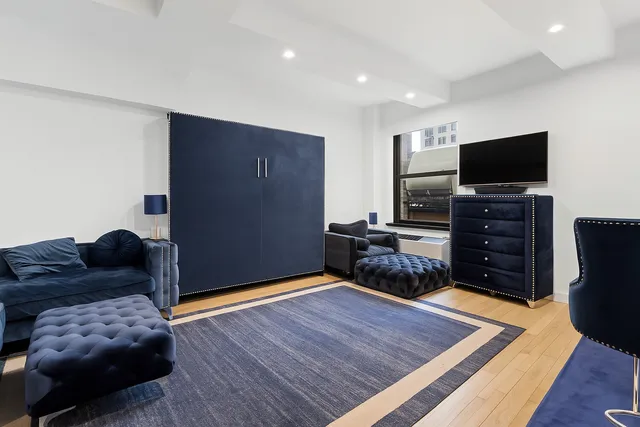 a kitchen with stainless steel appliances a stove a sink and a refrigerator