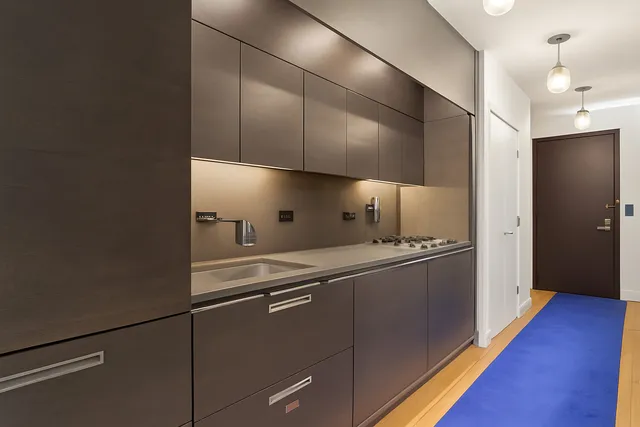 a workspace with furniture and a chandelier