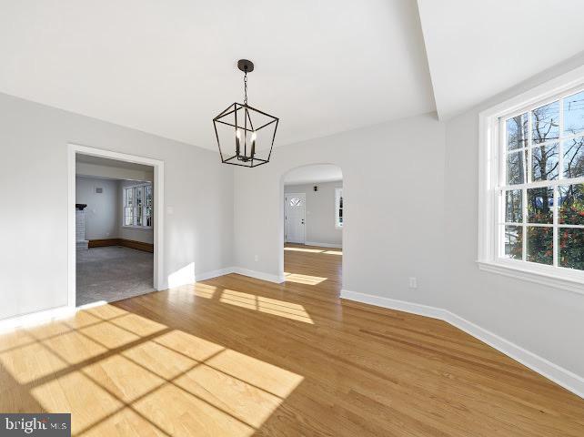 201 Grape Street Hammonton, NJ 08037 - Photo 12 of 34 a bedroom with a bed and a chandelier