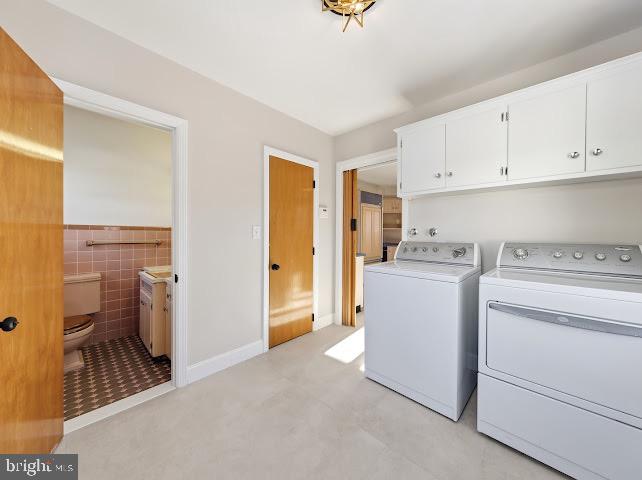 201 Grape Street Hammonton, NJ 08037 - Photo 20 of 34 a view of storage and utility room with closet dryer and washer