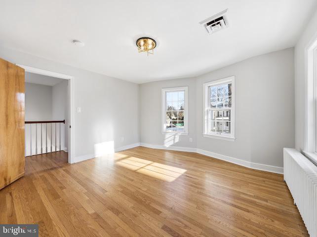 201 Grape Street Hammonton, NJ 08037 - Photo 22 of 34 a view of an empty room with wooden floor and a window