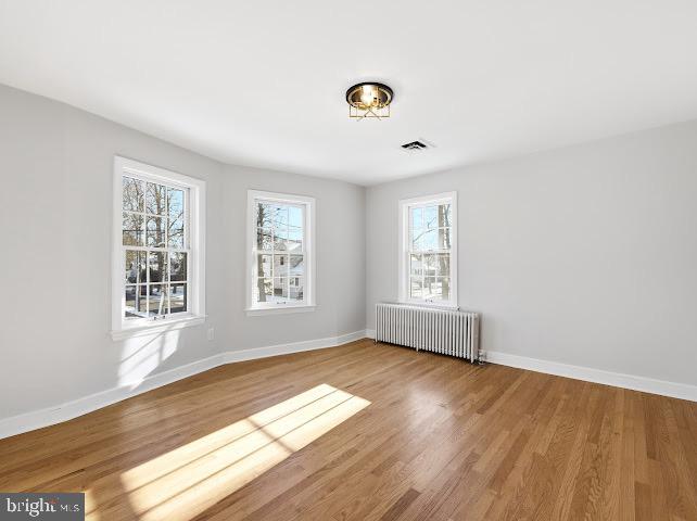 201 Grape Street Hammonton, NJ 08037 - Photo 23 of 34 a view of an empty room with wooden floor and a window