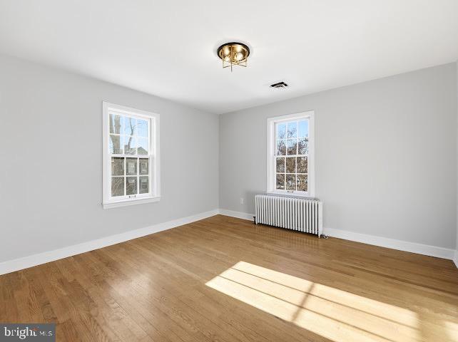 201 Grape Street Hammonton, NJ 08037 - Photo 26 of 34 a view of an empty room with wooden floor and a window