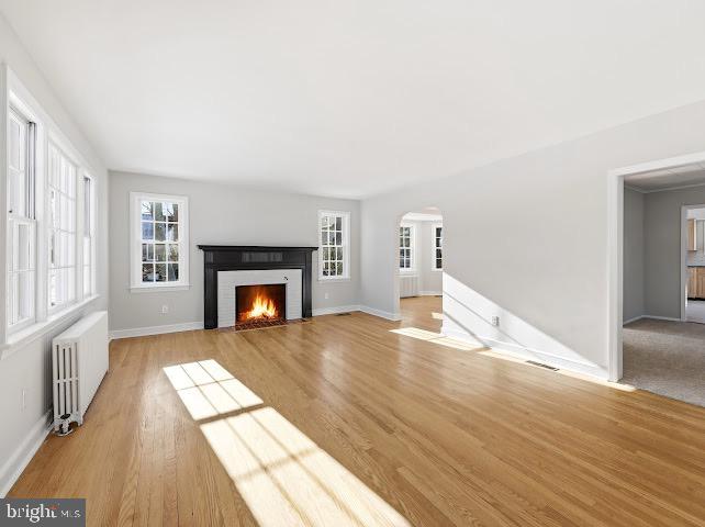201 Grape Street Hammonton, NJ 08037 - Photo 6 of 34 a view of empty room with wooden floor and fireplace
