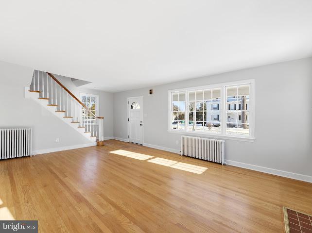 201 Grape Street Hammonton, NJ 08037 - Photo 8 of 34 a view of an empty room with wooden floor and a window